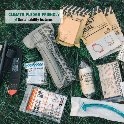 IFAK Trauma Kit With CAT Tourniquet For Military Combat And Everyday Readiness MOLLE Pouch Tactical First Aid Kit contents displayed on grass