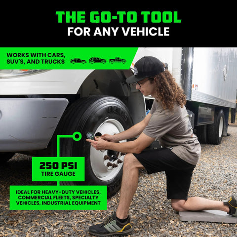 Rhino USA digital tire pressure gauge 0-250 PSI with glowing dial used on heavy-duty truck tire.