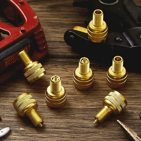 20 Pcs Large Bore Tire Valve Adapters Brass 22mm External Stem Reducers Connectors In Gold on wooden surface
