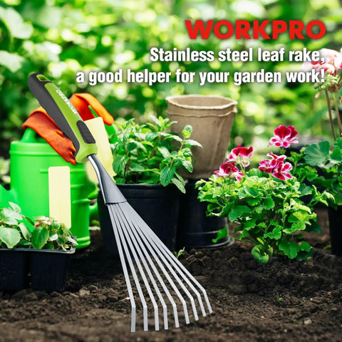 Handy 16 Inch Compact Stainless Steel Hand Rake With Soft Grip Handle Versatile Small Garden Rake For Delicate Plants Leaves Mulch Spreading And Light Soil Tilling In Narrow Beds And Flower Borders in a garden scene with various plants and pots.