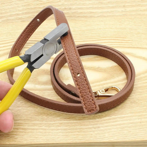 2mm Small Hole Punch Pliers For Watch Bands And Leatherwork 5.5 Inch Round Metal Hole Puncher in action on brown leather strap