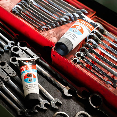 AGS SIL-Glyde silicone brake lubricant tubes, 2 tubes, 4 oz each, in a toolbox with wrenches
