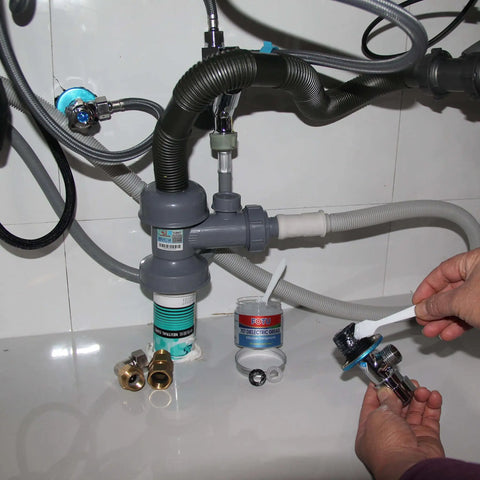 Hands applying dielectric grease for electrical connectors and battery terminals, spark plugs, and O ring seals, waterproof silicone lube for automotive use, 4 oz one pack, heavy duty insulation and moisture protection, to plumbing fittings.