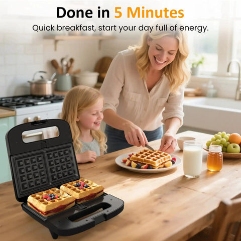 3 In 1 Waffle, Grill And Sandwich Maker With Removable Nonstick Plates, making waffles on a table with mother and child nearby