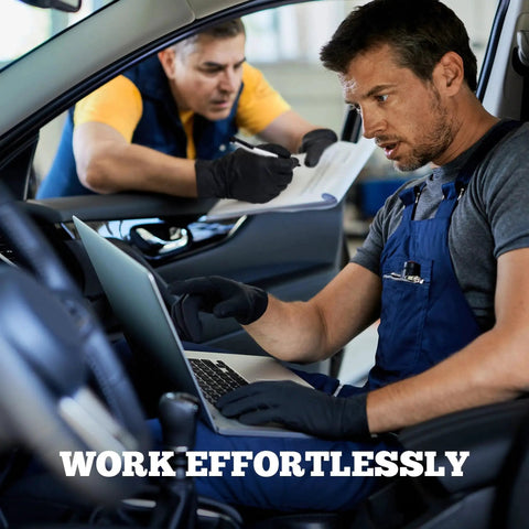 Mechanic wearing Heavy Duty Black Nitrile Exam Gloves 6-Mil Large working on laptop in car, another mechanic with clipboard in background