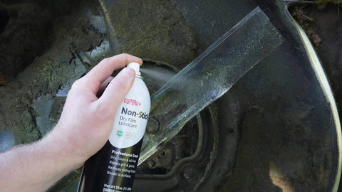 Applying Dry Film Teflon Non-Stick Lubricant Aerosol, 10 Oz, ultra-slick dirt-repelling coating on metal surface.