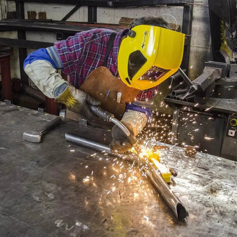Person welding metal on table using Pivot Angle 200 Adjustable Welding Magnet For Metal Fabrication And Welding Projects, Multi Angle Magnetic Holder With Clamp On Off Cap, 22 To 270 Degree Range, 200 Lb Holding Force, Versatile Weld Fixture Tool visible.