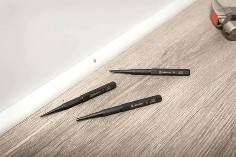 Pro Grade 3 Piece 5 Inch Steel Punch Set With Black Oxide Finish, Laser Etched Size Markings 1/32 2/32 3/32 Inch on a wooden surface