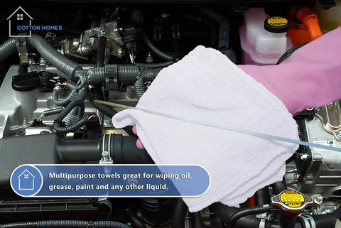 Gloved hand using Tough As Nails Cotton Shop Towels 12x14 Inches Pack Of 50 Plus 5 Bonus Reusable Cleaning Rags in auto engine bay