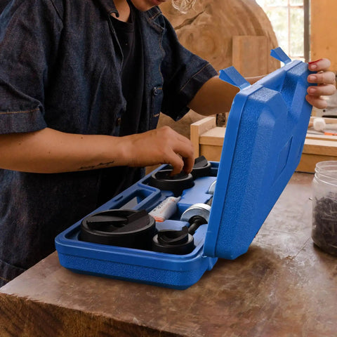Person using Pro Grade Knockout Hole Punch Set From Half Inch To Two Inch For Sheet Metal And Electrical Conduit with ratchet kit