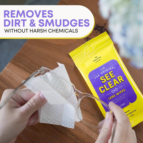 Person using lens cleaning wipes from yellow See Clear pack on glasses.