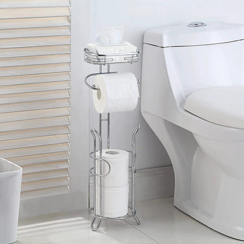 Free Standing Chrome Toilet Paper Holder With Reserve Shelf And Storage Basket next to toilet in bathroom