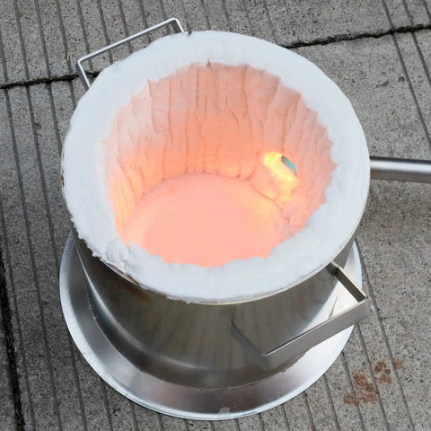 Lyrufexon ceramic fiber insulation blanket, 24x15.7x1 in, white lining inside a metal forge with glowing interior