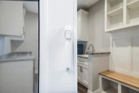 Close-up of white push-button latch on Corrosion Resistant Screen Door Hardware Kit With Pneumatic Closer And Push Button Latch For Out Swinging Doors No Lockout Feature Includes Hold Open Washer And Jamb Bracket White.