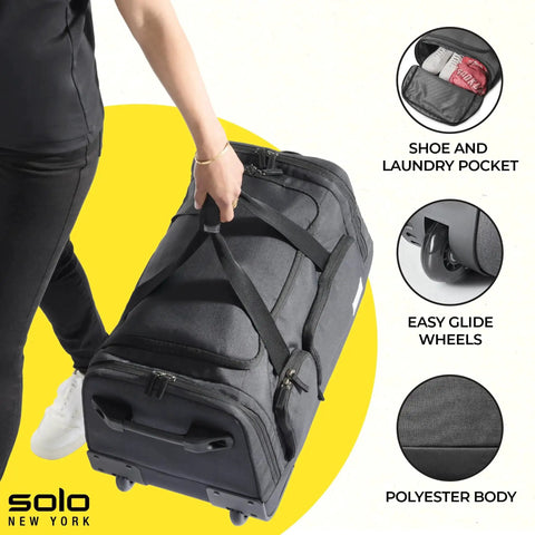 Person holding Go-To Rolling Duffle For Travel With Wheels 49L Capacity Carry-On Ready at 12x22x12 Inches Solo New York Leroy Gray.