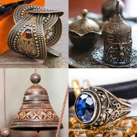 Assorted metal crafts including jewelry, bells, and ornamental items showcasing intricate designs and patina finishes.