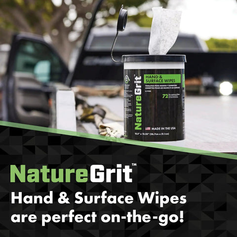 NatureGrit Hand and Surface Wipes on truck tailgate, perfect for on-the-go cleaning, pack visible with lid open.
