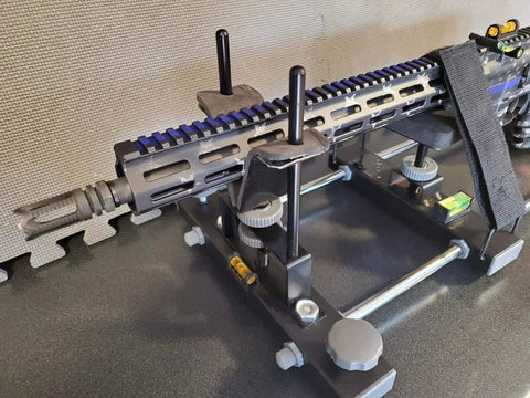 Rifle mounted on stand using Four Pack Gunsmith Scope Leveling Bubble Tools With Magnetic Base For Optics Mounting And Rifle Alignment.