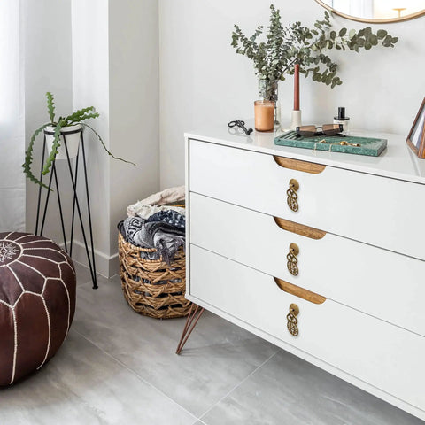 Wealth And Longevity Brass Cabinet And Furniture Pulls Set Of 2 in 2 inches wide on white drawer in interior setting.