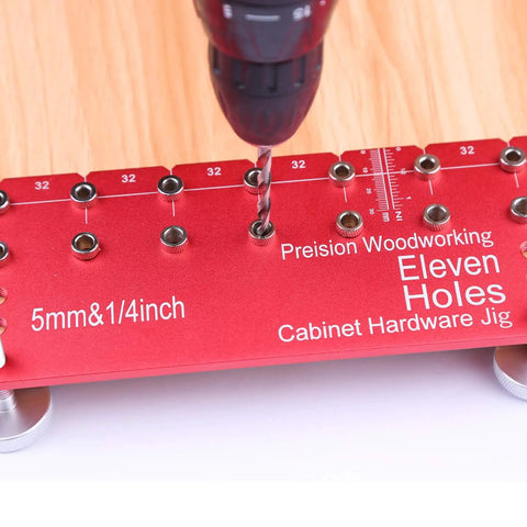 11 Hole All Metal Shelf Pin Jig With Self Contained Clamping For Easy No Fuss Drilling Drill Guide For Quick Precise Woodworking And Furniture Assembly Includes 1 Quarter Inch And 5 Millimeter Drill Bits in use on wood, close-up view.