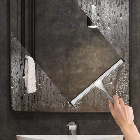 Hand using Stainless Steel Shower Squeegee 10 Inch With Adhesive Hooks For Glass on bathroom mirror with water droplets