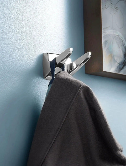Donnor Collection Chrome Wall Mount Hand Towel Ring 6.25 Inch Diameter installed on blue bathroom wall with towel