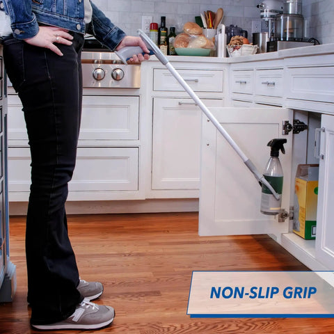 Person using 32 Inch Grabber Plus Reacher Tool With Built In Magnet For Trash Pickup And Yard Cleanup ergonomic claw in kitchen