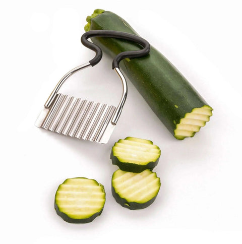 Crinkle Cutter For Fruits And Veggies With Non Slip Comfort Rubber Handle And Zigzag Stainless Steel Blade, Endurance Collection By RSVP International, 18 8 Stainless Steel, Dishwasher Safe, 4.5 By 3 Inches cutting zucchini with zigzag pattern.