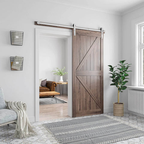 Brushed Nickel Barn Door Hardware Kit For 36 Inch Wide Doors Heavy Duty Sliding Track With Quiet Operation Easy To Install 6 Feet Rail System J Shape Hanger Fits 36 Inch Door Smooth And Durable Frame For Home Interior. Installed in a modern living room.