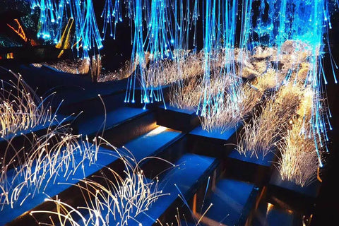 End Glow PMMA Fiber Optic Cable Strands Roll creating starry ceiling effect with blue and white light, flexible for creative lighting designs.
