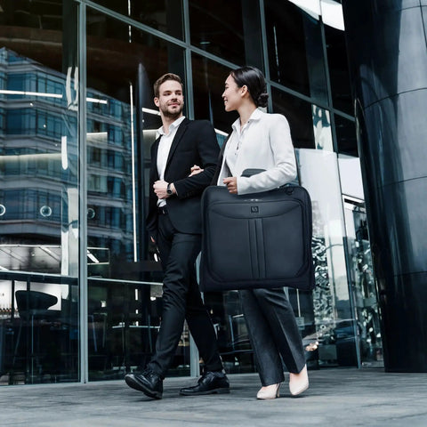 Business professionals carrying Premium Suit Garment Bag Carry On For Travel And Business With Over Shoulder Strap by ZEGUR.