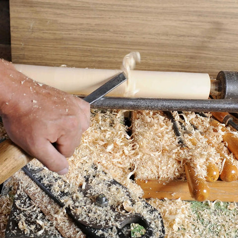 Person using Premium 8 Piece Wood Turning Chisel Set For Lathe Turning With 2 Skew Chisels 1 Spear Point 1 Parting Tool and more
