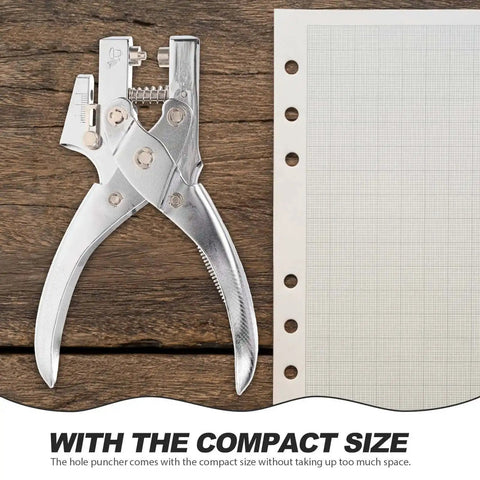 Handheld Metal Hole Puncher For Office And Crafts next to lined paper, showcasing compact design and titanium alloy material.