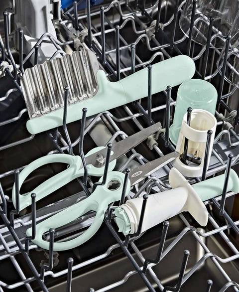 Crinkle Cutter For Kids Safe Food Prep And On The Go Mealtime Fun With Easy Grasp Shapes For Babies And Toddlers OXO Tot Crinkle Cutter in dishwasher with other kitchen tools.