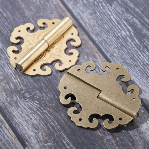 Two Piece Brass Flower Cloud Hinge Set For Jewelry Boxes And Furniture Decor With Screws 60 By 55mm shown on wood surface