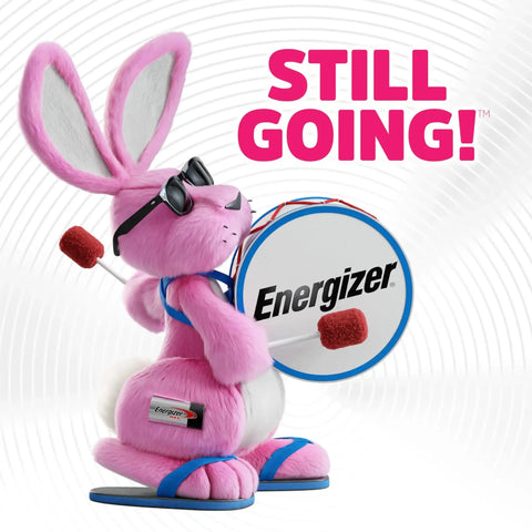 Pink bunny wearing sunglasses with a drum featuring Energizer logo, text "Still Going!" in the background.