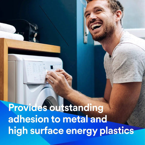 Man applying Adhesive Transfer Tape 467MP to washing machine panel for strong bonding of metal and high-energy plastics.