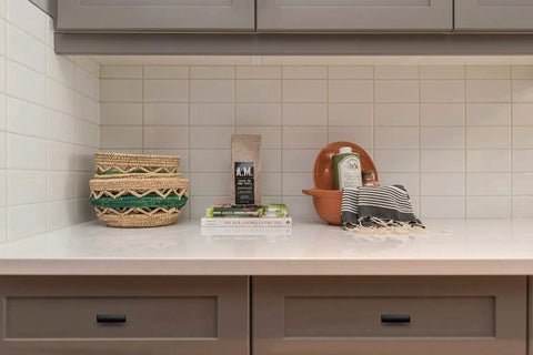 Kitchen counter with decorative items and cabinets featuring Curved Matte Black Cabinet Pulls 10 Pack For Kitchen And Home Cabinets 1.75 Inch Length 12 Mm Diameter 23 Mm Projection Zinc Alloy Construction Simple Modern Cupboard Handles For A Sleek Coordinated Look.