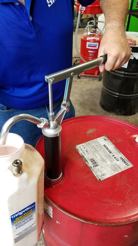 Guardian Lever Action Drum Transfer Pump For 16 To 55 Gallon Drums With 2 Inch Bung And Bushing, 10 Oz Per Stroke, in use