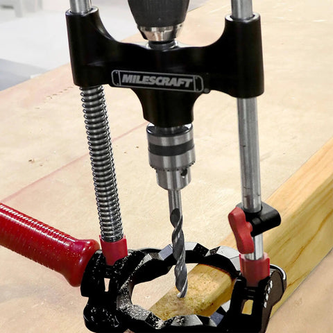 Portable Drilling Guide Attachment For Straight And Angled Holes With Adjustable Angle Readout in use on wood surface