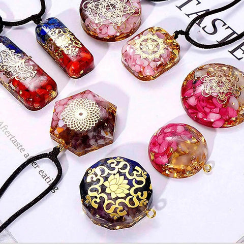 Colorful resin pendants with intricate designs from the All In One Resin Kit For Beginners And Pros With 125 Pieces Jewelry Making Set.