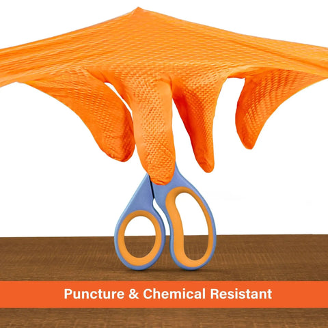 Orange Nitrile Disposable Gloves With Raised Diamond Grip Mechanic 100 Count showing flexibility and grip with scissors.