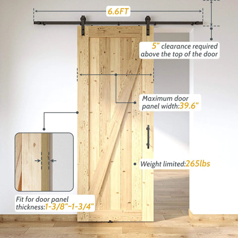Lite Version Black 6.6 Foot Barn Door Hardware Kit with Sliding Track System installed on a wooden door in a home setting.