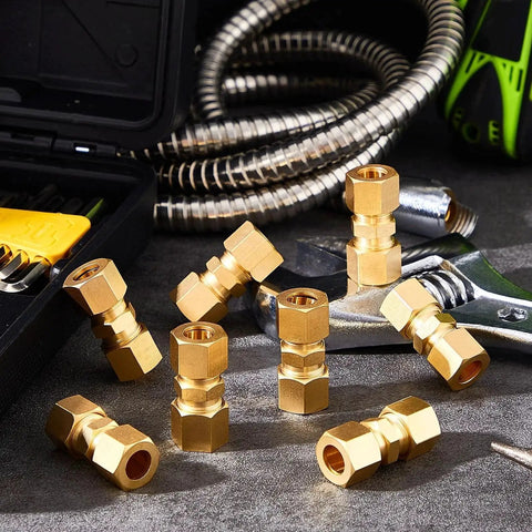 4 Pack Brass Compression Tube Fittings 3/8 Inch OD Union Connectors for copper, aluminum, and plastic tubing displayed on a workbench.