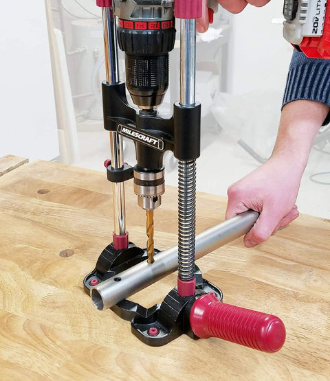 Portable Drilling Guide Attachment For Straight And Angled Holes With Adjustable Angle Readout in use on wooden table