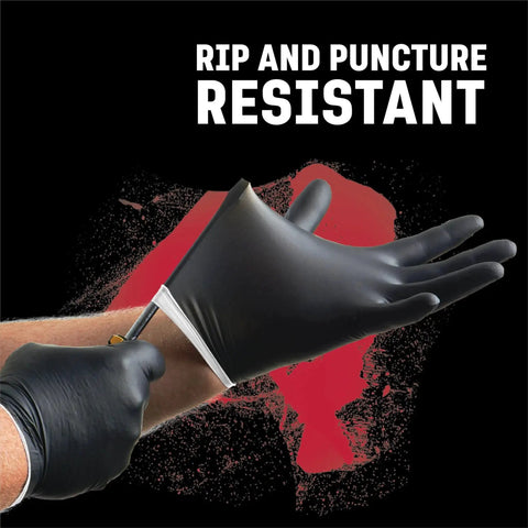 Person testing the rip resistance of Industrial Nitrile Gloves 6 Mil Two Layer Rip Resistant 100 Count with a sharp tool.