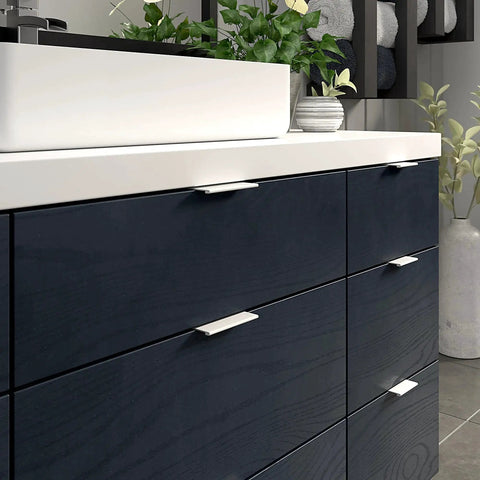 Lincoln Collection 3 1/8 Inch Center to Center White Modern Cabinet and Drawer Edge Pull Handle installed on dark cabinetry