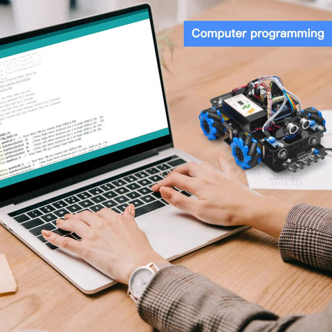 Person programming Mecanum Wheels Omni Directional Robot Car Kit For Arduino Mega2560 on laptop