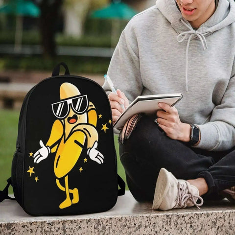 Cool Banana Style Backpack For Men And Women Go To Everyday Travel And Hiking 17 Inch Capacity With Durable 600D Oxford Fabric on ground next to person writing in notebook.