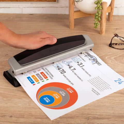 Person using Office Workhorse 3 Hole Paper Punch With Adjustable 2 To 3 Hole Settings 10 Sheet Capacity Heavy Duty Metal Puncher Black And Silver